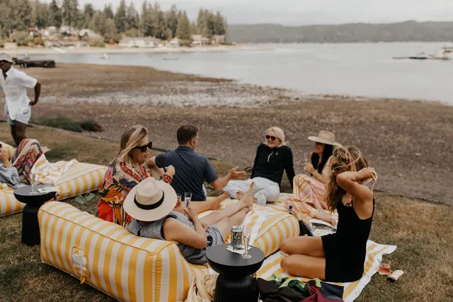 Guests relaxing on the lawn by Hood Canal