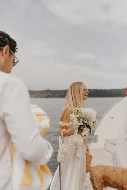 Wedding flowers and sunglasses on the dock