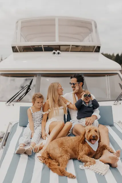 Katie and Danny with family and the dogs on the bow