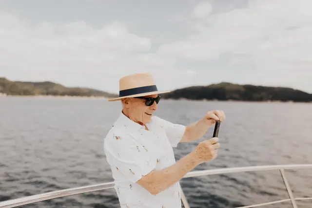 A guest taking a photograph from the boat