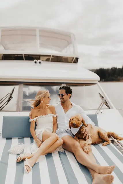 Katie and Danny relaxing on the bow with family and the dogs