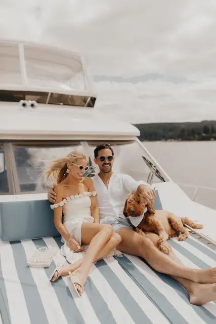 Katie and Danny relaxing on the bow with family and the dogs