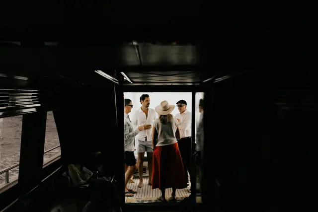 Family and guests gathering aboard the boat