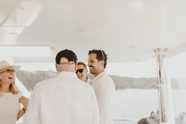 Family and guests gathering aboard the boat