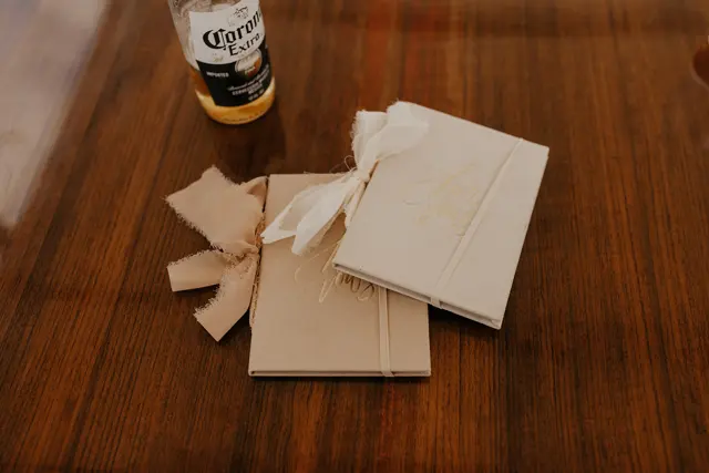 Wedding vow books on a wooden table