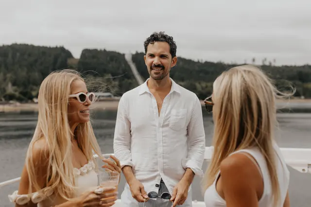Katie and Danny sharing a toast with family