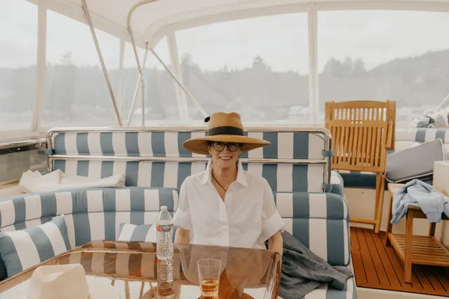 A guest seated on the boat before the ceremony