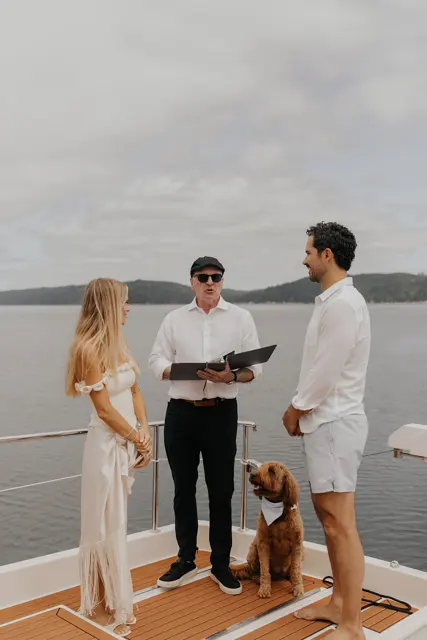 Katie and Danny exchanging vows on Hood Canal