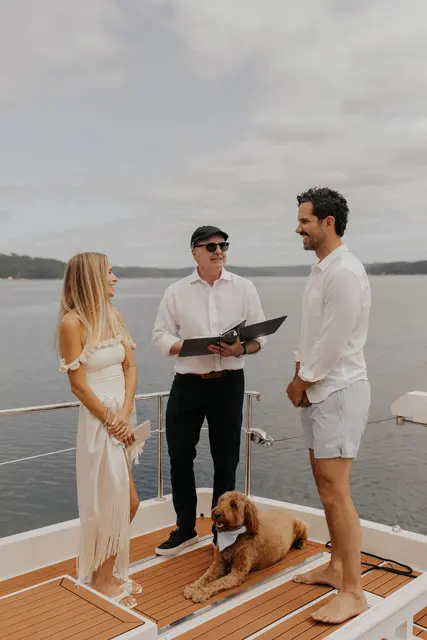 Katie and Danny exchanging vows on Hood Canal