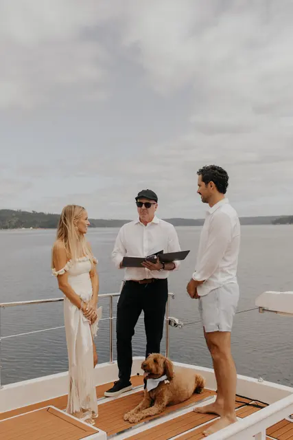 Katie and Danny exchanging vows on Hood Canal