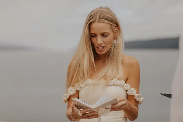 Katie reading her wedding vows to Danny