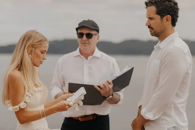 Katie reading her wedding vows to Danny