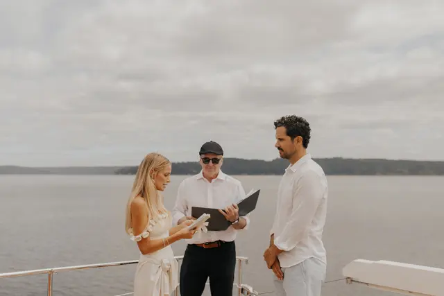 Katie reading her wedding vows to Danny